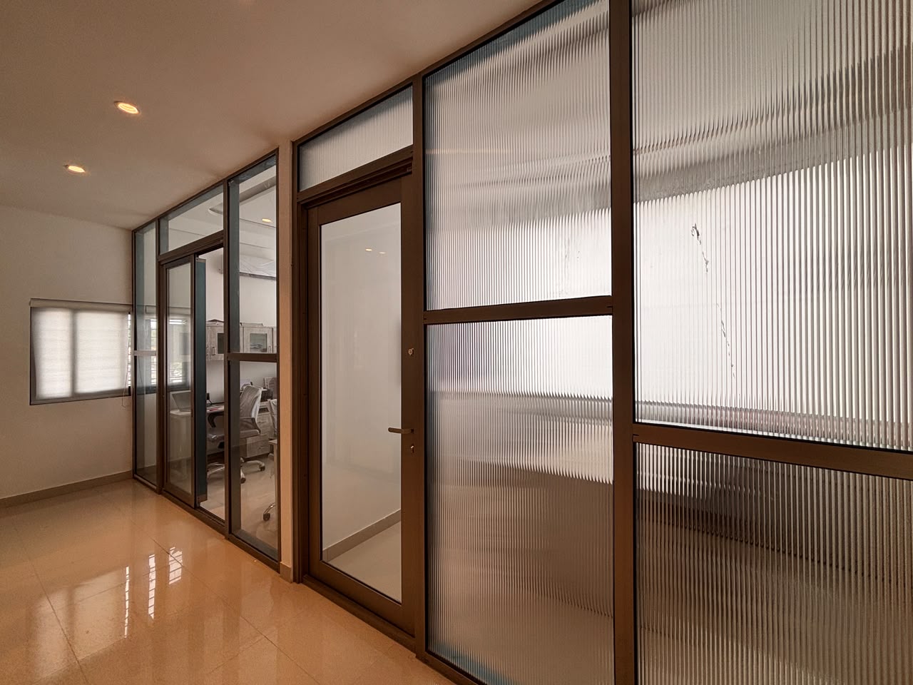 Glass partition corridor with aluminium framing