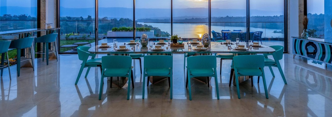TOSTEM showroom dining and lounge setting with panoramic lake view