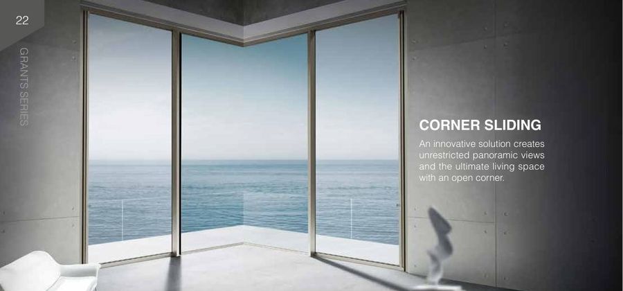 Corner sliding glass doors opening to an ocean view